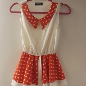 Red and white sleeveless blouse with Peter pan col